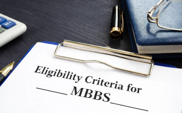 Clipboard with eligibility criteria for MBBS in Russia highlighting NEET requirement, PCB marks, age limit, and requirements for Indian students planning to study MBBS in Russia