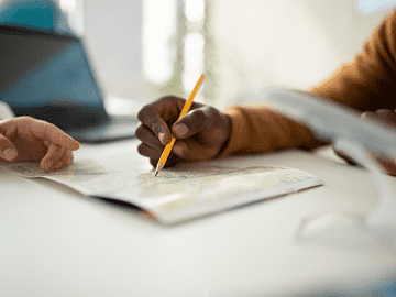 Student marking details on a document, representing the AMA School of Medicine fee structure, tuition costs, housing, food expenses, and affordable MBBS education in Philippines
