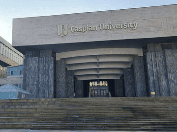 Caspian University building representing Asian Medical Institute affiliation and recognition, approved by MOE, Ministry of Health, NMC, WHO, FAIMER, MCI, USMLE and PLAB.