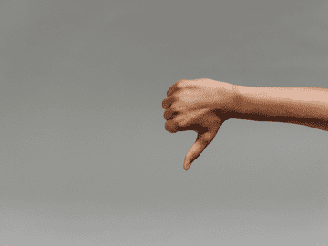 Thumbs down gesture representing disadvantages of Kabardino Balkarian State Medical University including language barrier, cold climate, cultural differences, distance from home, and limited English resources.