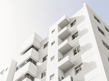 Modern university building representing Asian Medical Institute admission process including online application, document submission, admission letter, fee payment, and student visa procedure.