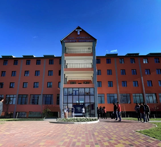 David Tvildiani Medical University modern campus building in Tbilisi, Georgia with students walking outside, highlighting one of the top universities in Georgia for MBBS for Indian students.