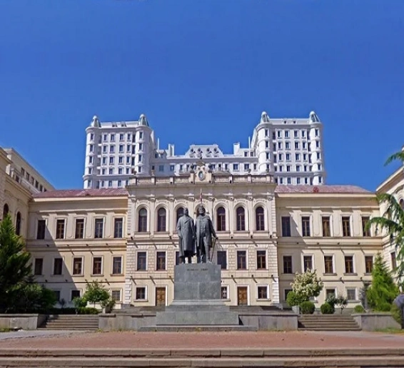 Tbilisi State Medical University historic campus building in Georgia with statues in front, representing one of the top universities in Georgia for MBBS for Indian students.